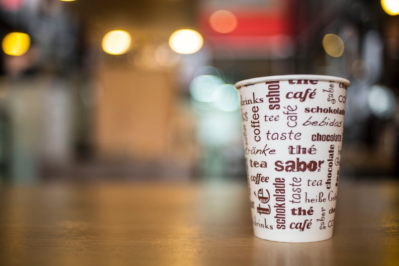 Selective-focus Photography of White and Brown Coffee Cup on Brown Wooden Surface